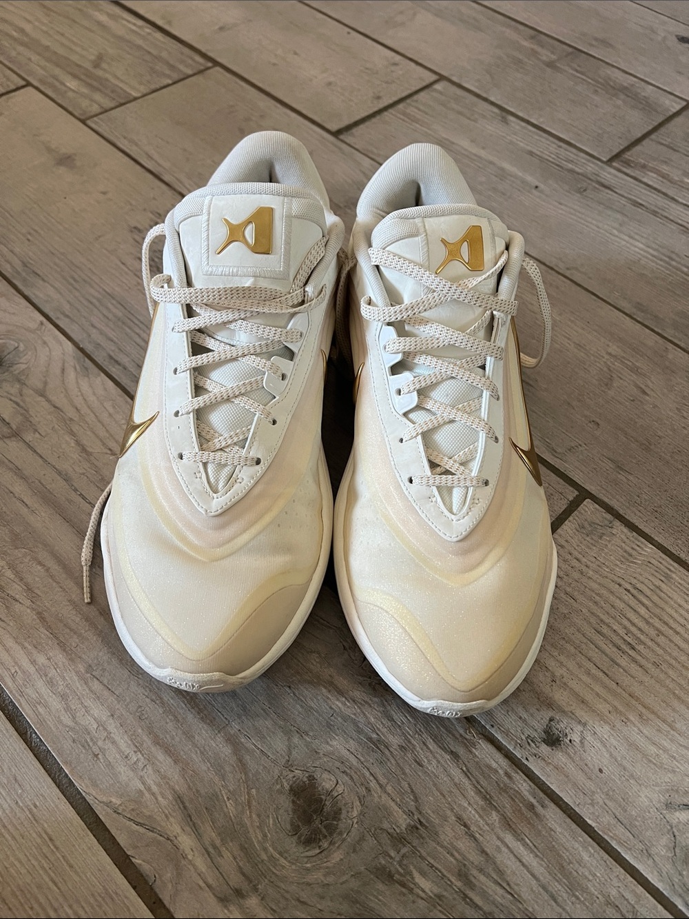 Nike Men's Cream Sneakers with Gold Accents